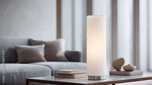 Elegant lamp illuminates a modern living space. Subtle light enhances a sophisticated interior. Ideal for design, lifestyle, and home decor concepts. Serene.