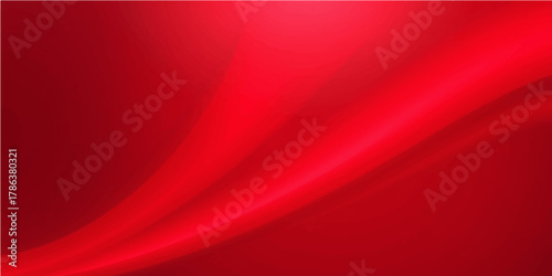 Flowing red silk satin textile backdrop with smooth texture and elegant light curves