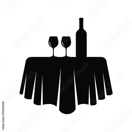 Black silhouette of wine bottle and two glasses on draped table