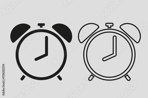 Two alarm clocks showing the time, one filled and one outlined