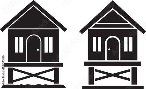 Two identical stilt houses silhouette