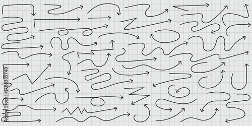 A collection of hand drawn black arrows pointing in different directions on graph paper background