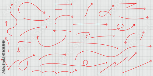 Collection of red hand drawn arrows on a grid paper background pointing in various directions and shapes