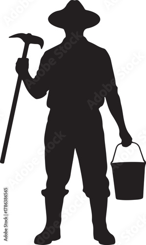 Silhouette depicts a miner wearing a hat and holding a pickaxe and bucket transparent background