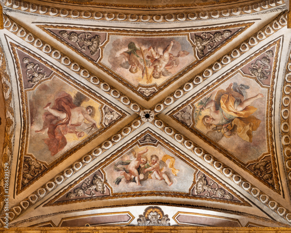 Fototapeta premium Perugia - The ceiling fresco of angels with the symbolic instruments in the church Cattedrale di San Lorenzo by local artists (Accademia di belle Arti) from 18. and 19. cent.