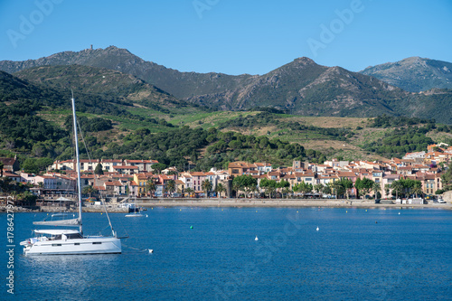 Fototapeta Naklejka Na Ścianę i Meble -  View of colourful Collioure, narrow streets and yellow, pink, orange houses, summer vacation destination town with historical buidings and beaches, Pyrenees-Orientales, France
