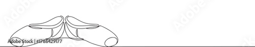 A pair of elegant ballet pointe shoes with ribbons, drawn in a graceful continuous line art style