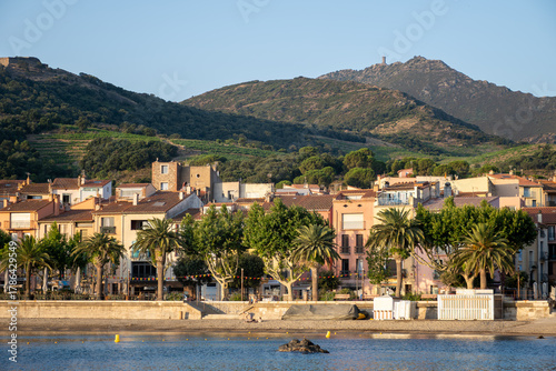 Fototapeta Naklejka Na Ścianę i Meble -  View of colourful Collioure, narrow streets and yellow, pink, orange houses, summer vacation destination town with historical buidings and beaches, Pyrenees-Orientales, France