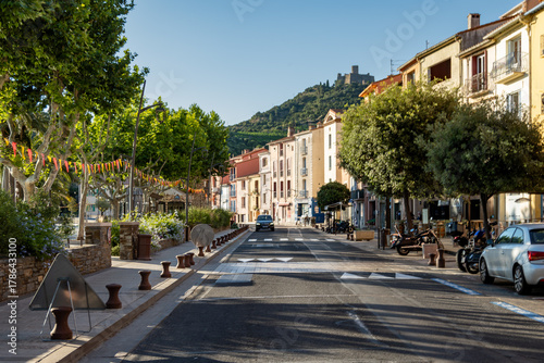 Fototapeta Naklejka Na Ścianę i Meble -  View of colourful Collioure, narrow streets and yellow, pink, orange houses, summer vacation destination town with historical buidings and beaches, Pyrenees-Orientales, France