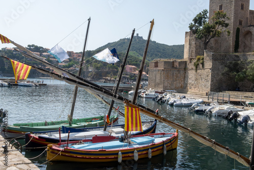 Fototapeta Naklejka Na Ścianę i Meble -  View of colourful Collioure, narrow streets and yellow, pink, orange houses, summer vacation destination town with historical buidings and beaches, Pyrenees-Orientales, France