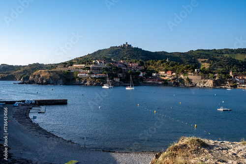 Fototapeta Naklejka Na Ścianę i Meble -  View of colourful Collioure, narrow streets and yellow, pink, orange houses, summer vacation destination town with historical buidings and beaches, Pyrenees-Orientales, France