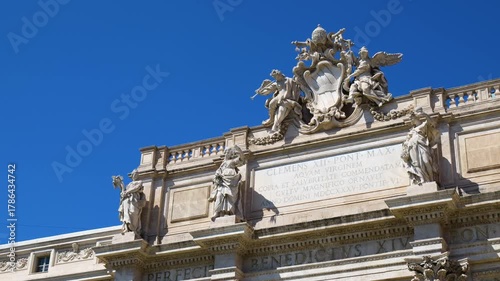 statues structure trevi fountain rome centers figures adorn upper section top view of detailed sculptural detail urban scene 