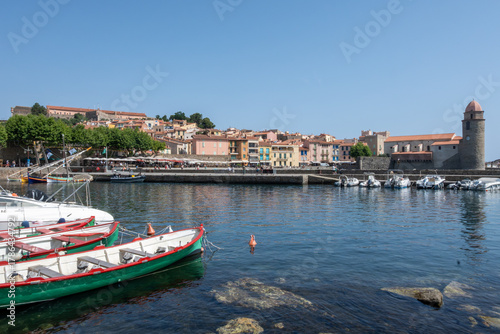 Fototapeta Naklejka Na Ścianę i Meble -  View of colourful Collioure, narrow streets and yellow, pink, orange houses, summer vacation destination town with historical buidings and beaches, Pyrenees-Orientales, France