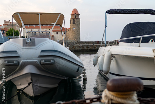 Fototapeta Naklejka Na Ścianę i Meble -  View of colourful Collioure, narrow streets and yellow, pink, orange houses, summer vacation destination town with historical buidings and beaches, Pyrenees-Orientales, France