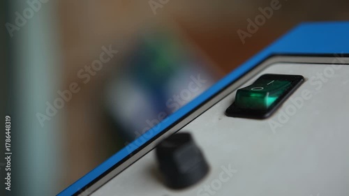 A man turns on the engine start button. Macro photography.