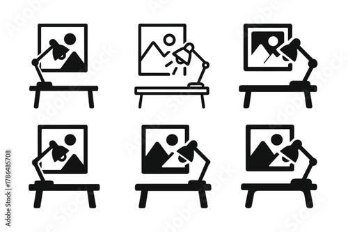 Creative Workspace Logos. Creative workspace with art on walls. Set Logo of Creative workspace with art on walls: desk lamp illuminating a canvas on the wall.