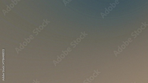 A soft focus background with a gradient of beige and light brown colors creating a calm and neutral tone