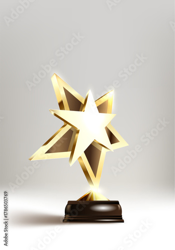 A shining golden star trophy on a black base, with metallic facets glowing against a gray background, symbolizing achievement and excellence.