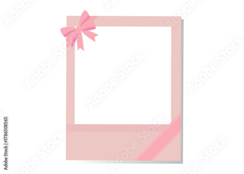 A pink instant photo frame decorated a small pink bow ribbon