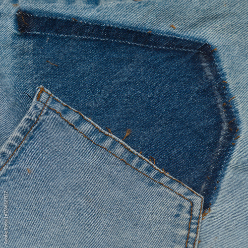 old jeans being taken apart for upcycling, unfaded patches showing
