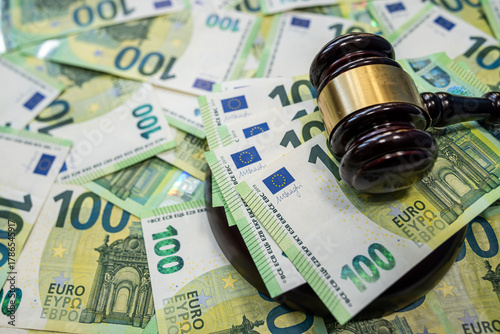Photography Judge gavel with 100 euro bills symbol of law and justice system