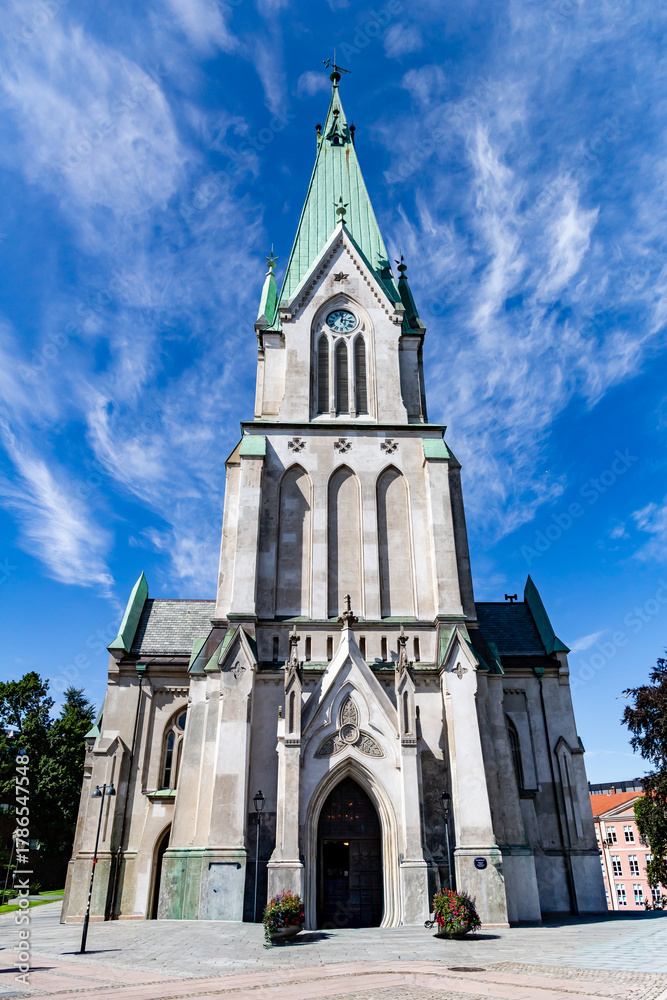 Fototapeta premium Kristiansand, Norway-August 12, 2025: Front View of Kristiansand Cathedral Tower