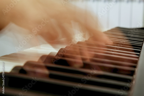 hands playing piano