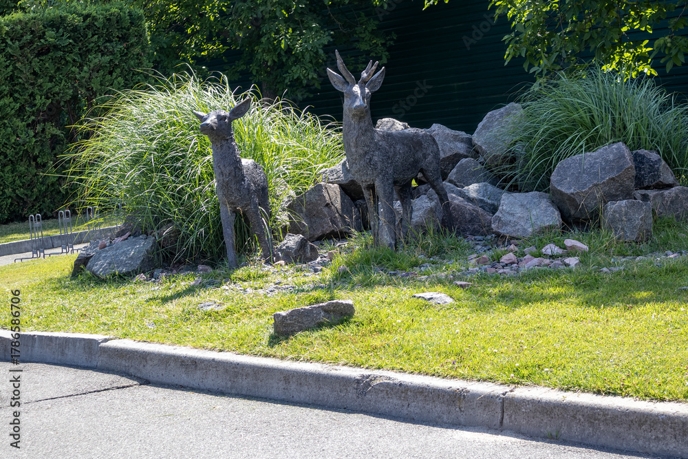 custom made wallpaper toronto digitalMetal deer sculptures in garden landscaping on sunny day