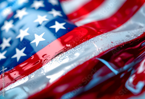 A close up of the American flag with water droplets on vibrant red white and blue fabric showing stars and stripes with a sense of patriotism and national pride
