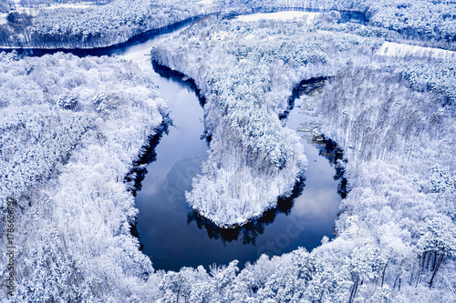 Winter winding river and sn...