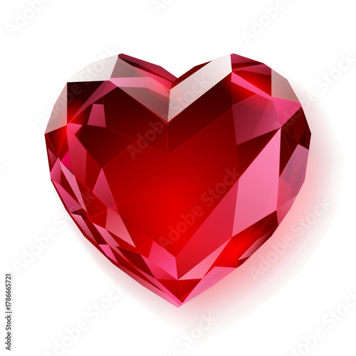 A bright red, heart-shaped gemstone is centered, showcasing multiple facets that reflect light, set against a clean white background with a soft shadow.