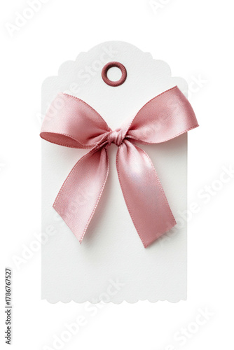 Tag with pink bow. Delicate, white paper, gift ready