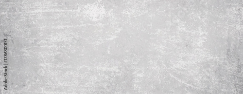 Grunge background with a textured, distressed look. The background is light gray, featuring a rough, gray surface with a worn appearance. Rough concrete texture background. Gray background vector.