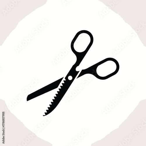 Black silhouette of pinking shears on a textured background