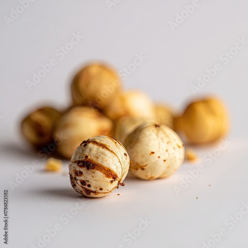 Closeup Of Roasted Whole Nuts On White Background