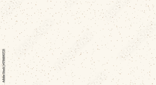 White speckled background with light tan dots, creating a subtle and natural texture perfect for design elements