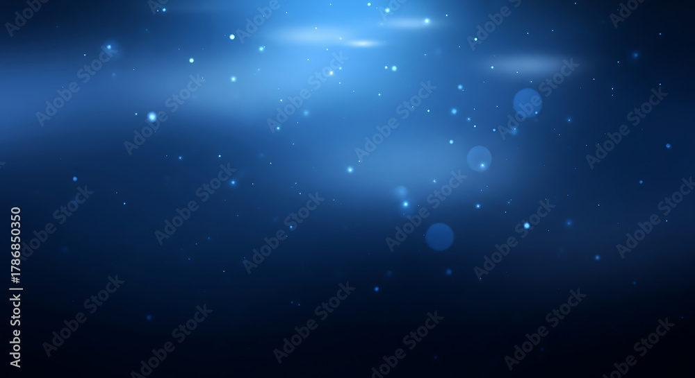 Fototapeta premium Abstract dark blue background with glowing particles and soft light flares creating a magical and ethereal atmosphere.