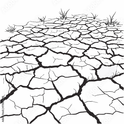 Dry cracked earth with sparse grass is a stark reminder of drought and climate change, creating a desolate and barren landscape