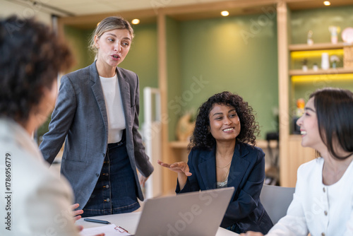 Leadership training, executive communication and team development in progress with diverse professionals in coaching seminar, strategic thinking and interpersonal skills in a modern workplace