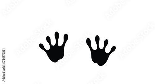 Black silhouette of two animal paw prints with four toes on a white background.