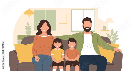 A happy family of four, parents and two children, sitting together on a comfortable sofa at home.