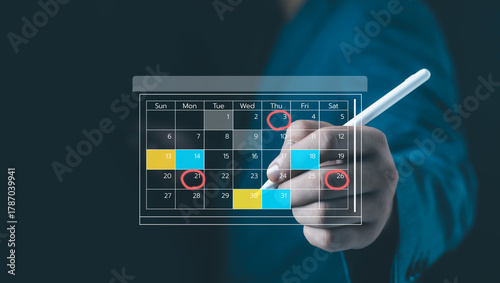 Canvas Print Businessman hand using digital pen to mark multiple dates on virtual calendar interface, representing scheduling, planning, event management, timeline organization, and productivity concept