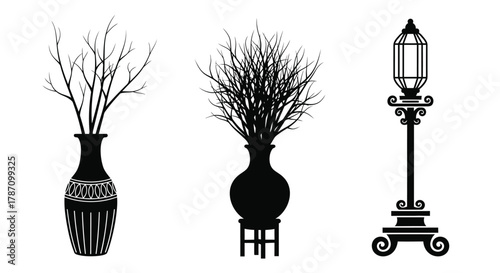 Elegant black vases with twigs and lantern for classic interior decor