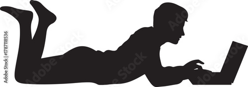 Silhouette of Person Lying on Stomach Using Laptop Computer Notebook Device at Home