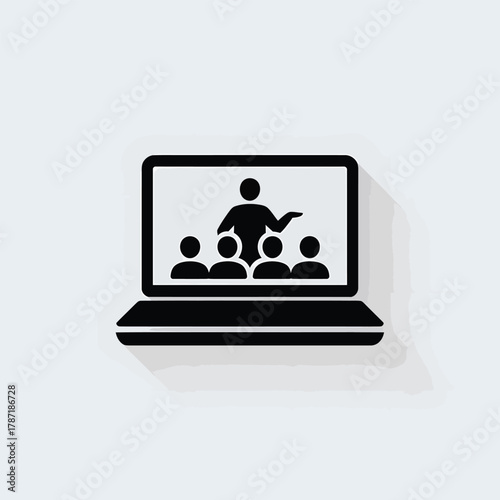 Laptop screen shows instructor teaching group of students online learning