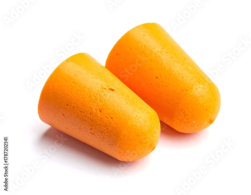 Close-up of two bright orange foam earplugs against white background