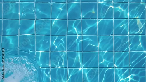 Water texture in a swimming pool with a view of the bottom