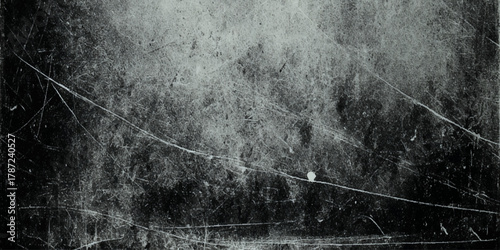 Black and white grunge texture with scratched distressed overlay, dark vintage noise background for design.