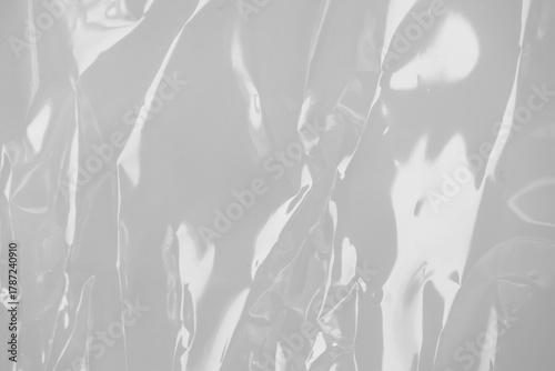 Φωτογραφία plastic transparent cellophane bag on white background