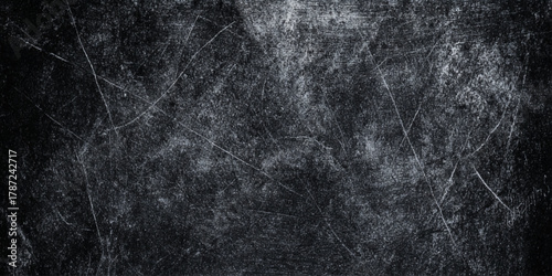 A dramatic black and white distressed surface with heavy scratches, scuffs, and weathered noise.